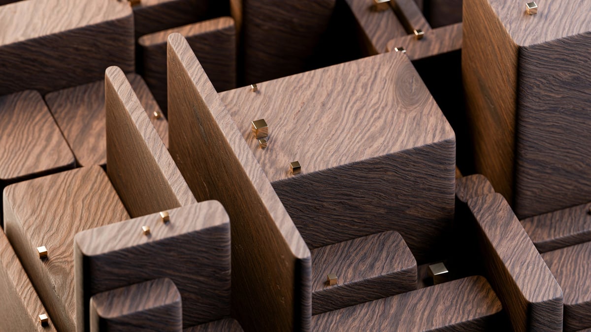 Wooden block pieces with varying light and dark stains arranged closely together showing grain texture and joinery details