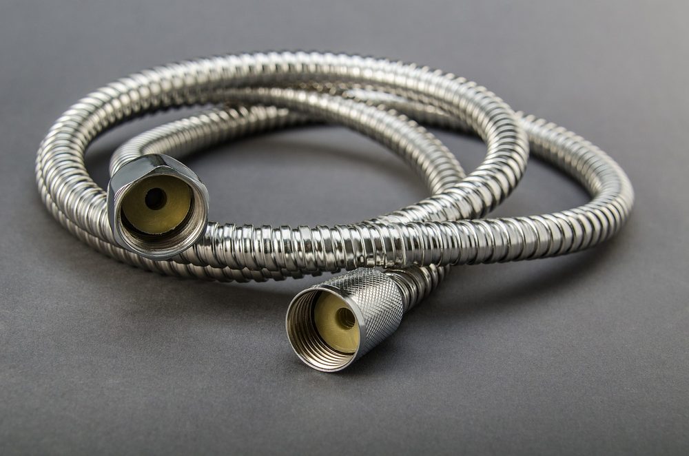 Coiled flexible water supply hose