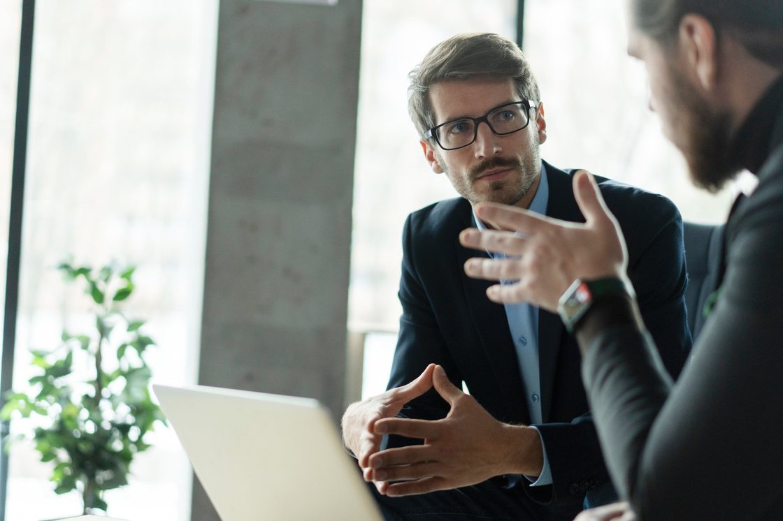 Two professionals in a meeting, website design for consultants and independent professionals